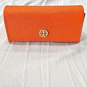 Tori Burch sunglasses case.